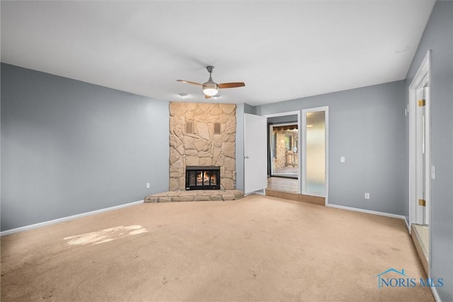 4550 W Sylvania Ave, Toledo, OH 43623 - unfurnished living room with carpet, a ceiling fan, baseboards, and a fireplace