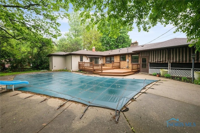 4550 W Sylvania Ave, Toledo, OH 43623 - view of pool with a wooden deck, a covered pool, and a patio area