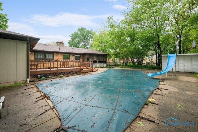 4550 W Sylvania Ave, Toledo, OH 43623 - view of pool featuring a water slide, a deck, and a patio