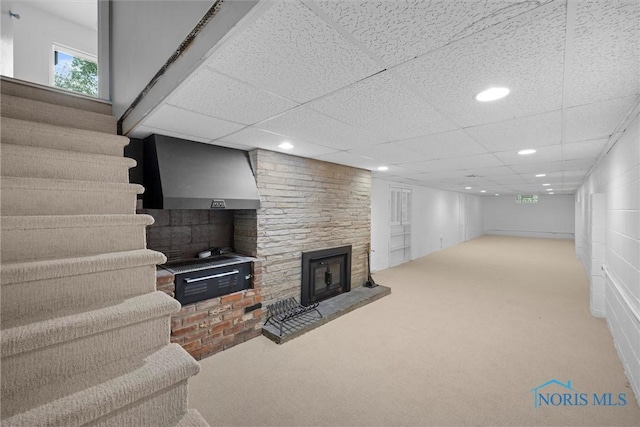 4550 W Sylvania Ave, Toledo, OH 43623 - basement featuring carpet flooring, a fireplace, recessed lighting, and a drop ceiling