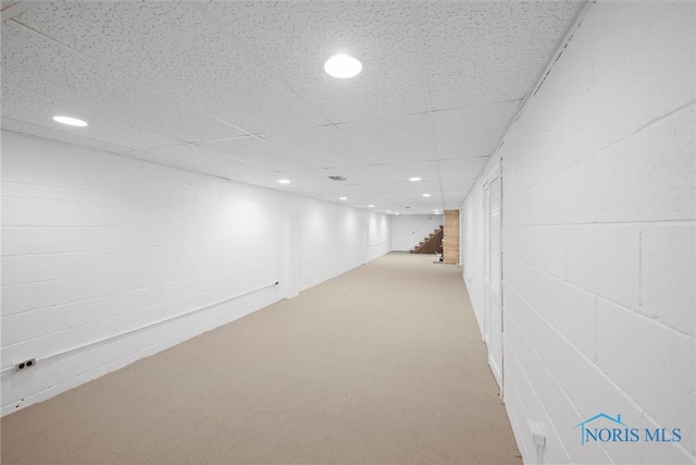 4550 W Sylvania Ave, Toledo, OH 43623 - hallway with stairs, light carpet, recessed lighting, a paneled ceiling, and concrete block wall