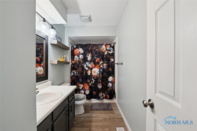 513 Bay River Ct, Maumee, OH 43537 - bathroom featuring vanity, wood finished floors, toilet, baseboards, and a shower with curtain