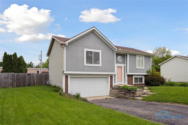 513 Bay River Ct, Maumee, OH 43537 - split foyer home featuring a garage, driveway, and brick siding