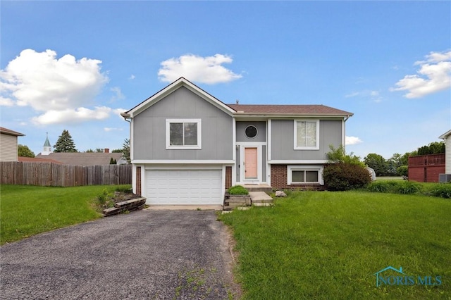 513 Bay River Ct, Maumee, OH 43537 - bi-level home with driveway and a garage