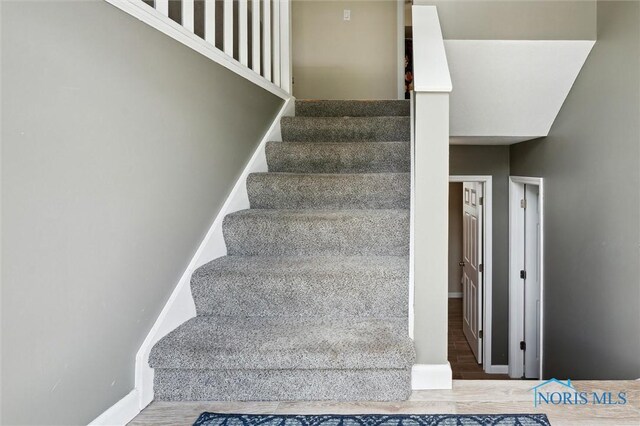 513 Bay River Ct, Maumee, OH 43537 - stairs with baseboards and wood finished floors