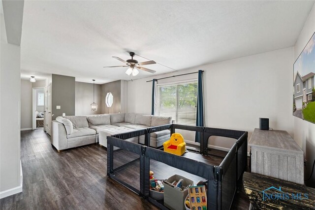 513 Bay River Ct, Maumee, OH 43537 - living room with wood finished floors, a ceiling fan, and baseboards