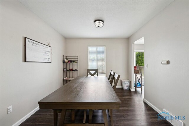 513 Bay River Ct, Maumee, OH 43537 - dining room featuring dark wood finished floors and baseboards