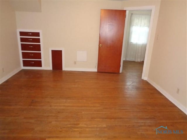 934 E 4th St, Ottawa, OH 45875 - unfurnished room featuring wood finished floors and baseboards