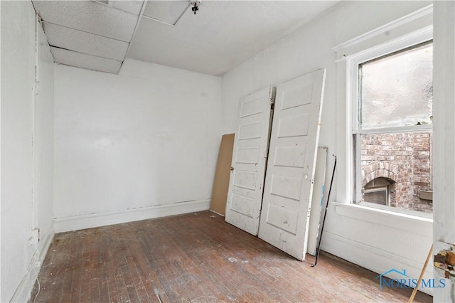 128 W Bancroft St, Toledo, OH 43620 - unfurnished room featuring hardwood / wood-style floors and a pendent fire sprinkler