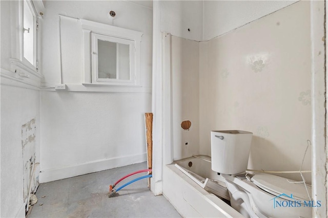 128 W Bancroft St, Toledo, OH 43620 - bathroom with unfinished concrete flooring, shower / bath combination, and toilet