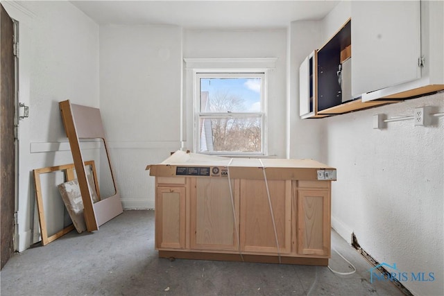 128 W Bancroft St, Toledo, OH 43620 - kitchen with light brown cabinets, light countertops, and baseboards