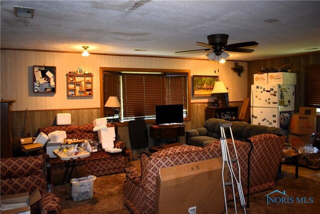 4260 S Eber Rd, Monclova, OH 43542 - living room featuring wood walls, ceiling fan, a wainscoted wall, and carpet floors