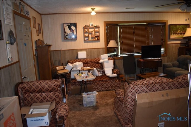 4260 S Eber Rd, Monclova, OH 43542 - living area with ornamental molding, a ceiling fan, wood walls, carpet floors, and a wainscoted wall