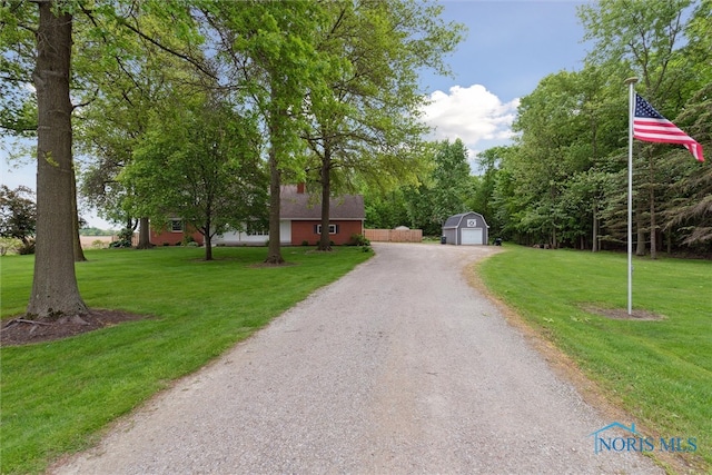 21265 State Route 2, Archbold, OH 43502 - view of front facade featuring a front lawn, a detached garage, and driveway
