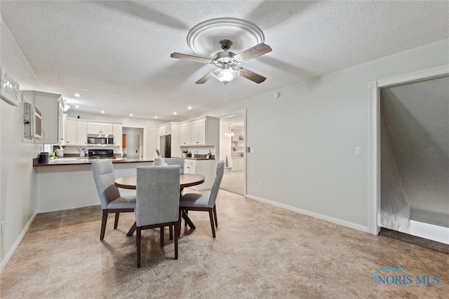 21265 State Route 2, Archbold, OH 43502 - dining space with ceiling fan, a textured ceiling, baseboards, and recessed lighting