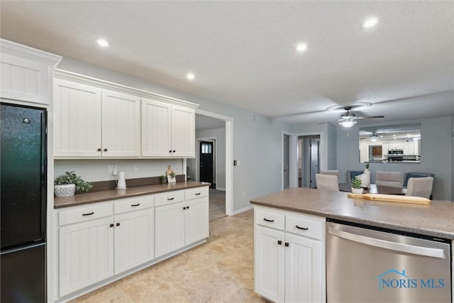 21265 State Route 2, Archbold, OH 43502 - kitchen with freestanding refrigerator, stainless steel dishwasher, a ceiling fan, white cabinets, and recessed lighting