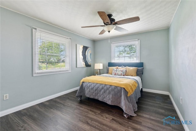 21265 State Route 2, Archbold, OH 43502 - bedroom with baseboards, dark wood-style floors, and a ceiling fan