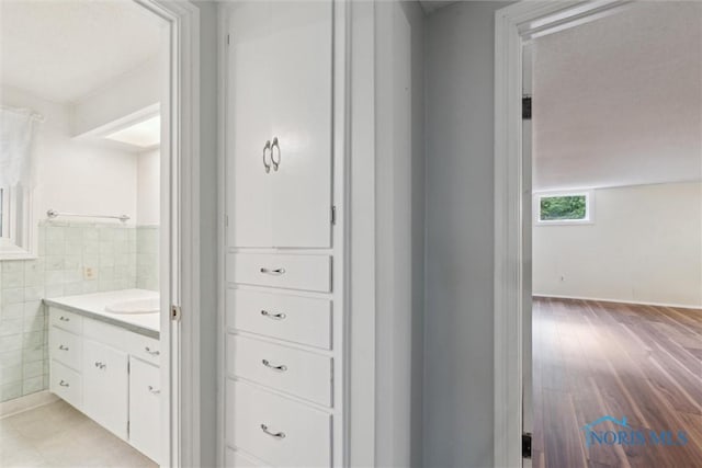 21265 State Route 2, Archbold, OH 43502 - bathroom with vanity, tile walls, and wood finished floors
