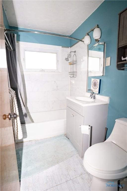 1702 E Hopkins St, Defiance, OH 43512 - bathroom with shower / tub combo with curtain, vanity, and toilet