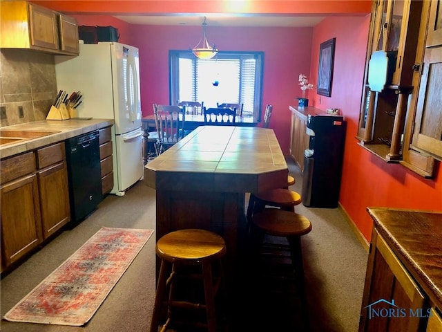 5151 Keller Rd, Walbridge, OH 43465 - kitchen featuring dishwasher, light colored carpet, tasteful backsplash, a center island, and brown cabinetry