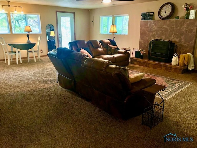 5151 Keller Rd, Walbridge, OH 43465 - living area with carpet, a tile fireplace, ceiling fan, and baseboards