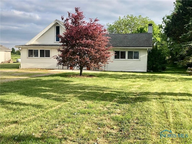 5151 Keller Rd, Walbridge, OH 43465 - view of property hidden behind natural elements with a front lawn and a chimney