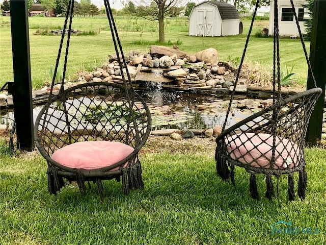 5151 Keller Rd, Walbridge, OH 43465 - view of green lawn featuring a garden pond