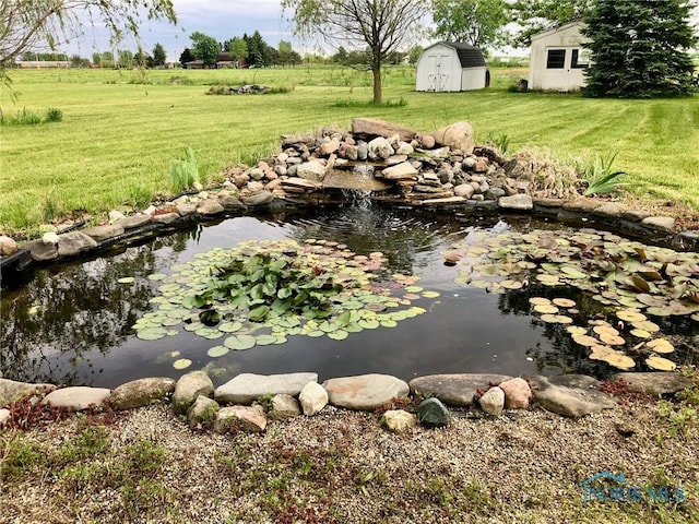 5151 Keller Rd, Walbridge, OH 43465 - view of grassy yard featuring a garden pond