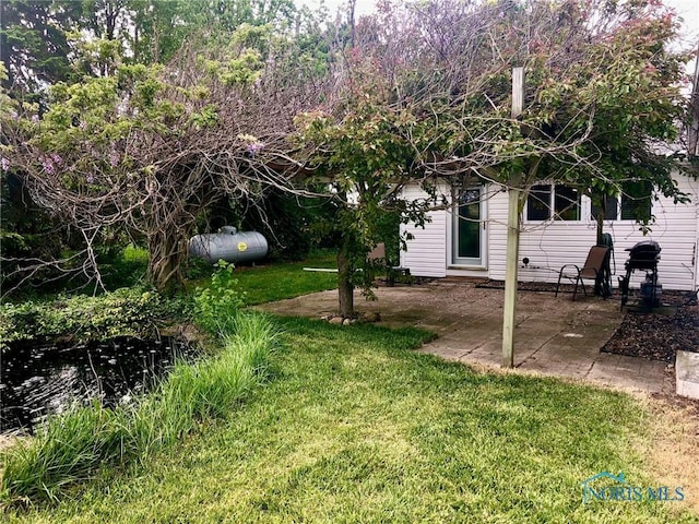 5151 Keller Rd, Walbridge, OH 43465 - view of grassy yard with a patio