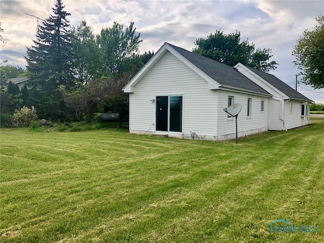 5151 Keller Rd, Walbridge, OH 43465 - back of property with a yard and roof with shingles