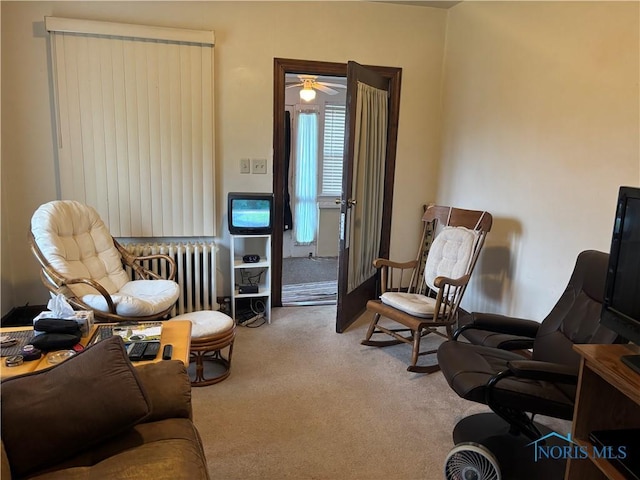 181 Osborne St, Rossford, OH 43460 - sitting room with radiator heating unit, carpet flooring, and ceiling fan