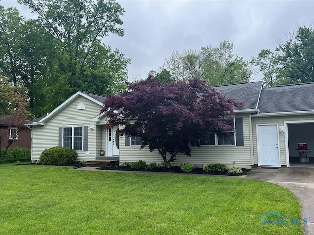 646 Clarion Ave, Holland, OH 43528 - view of front facade featuring a front yard and a shingled roof
