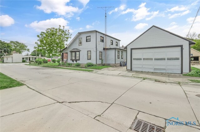 4927 N Summit St, Toledo, OH 43611 - view of front of home with a detached garage and an outbuilding