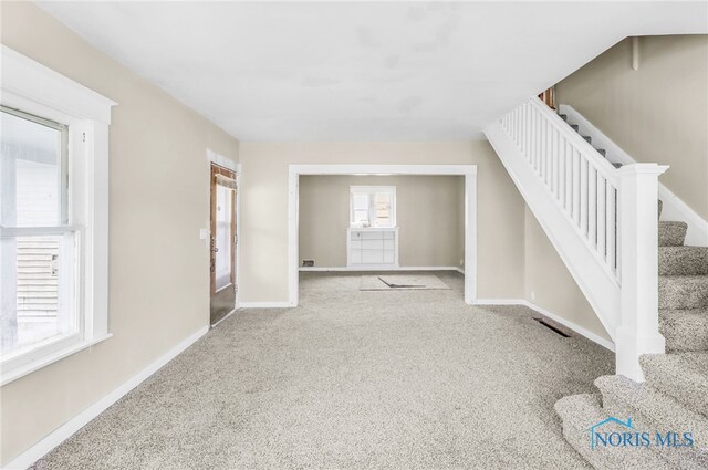 4927 N Summit St, Toledo, OH 43611 - entryway featuring stairs, carpet, and baseboards