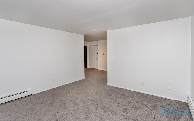 2340 Torrey Hill Dr, Toledo, OH 43606 - spare room with carpet floors, a baseboard heating unit, and baseboards
