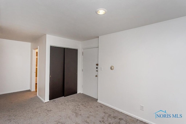 2340 Torrey Hill Dr, Toledo, OH 43606 - unfurnished bedroom with a closet, carpet flooring, and baseboards
