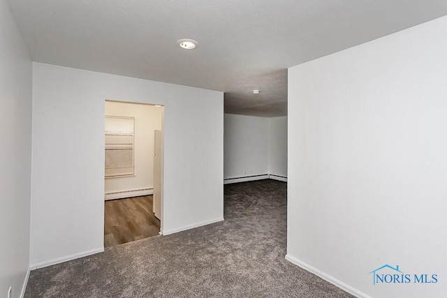 2340 Torrey Hill Dr, Toledo, OH 43606 - carpeted empty room featuring a baseboard heating unit and baseboards