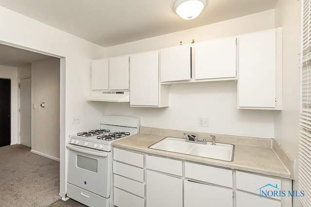 2340 Torrey Hill Dr, Toledo, OH 43606 - kitchen featuring white range with gas stovetop, a sink, under cabinet range hood, and light countertops