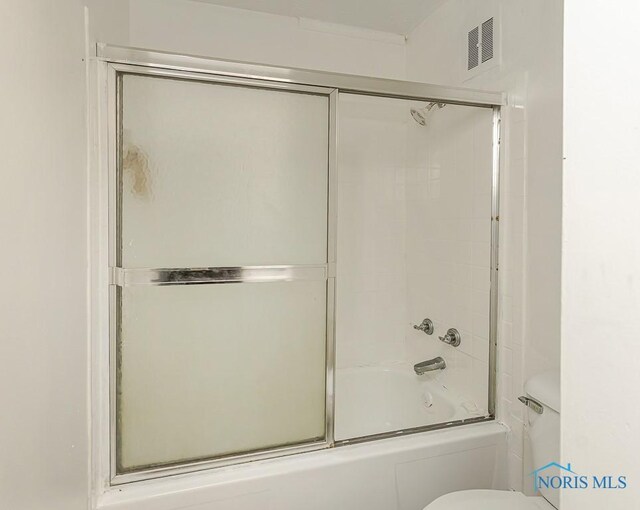 2340 Torrey Hill Dr, Toledo, OH 43606 - bathroom featuring toilet and enclosed tub / shower combo