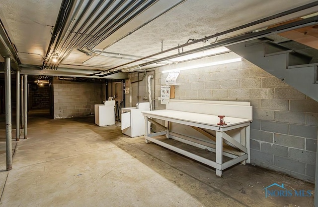 2340 Torrey Hill Dr, Toledo, OH 43606 - unfinished below grade area featuring stairs, concrete block wall, and washer and dryer