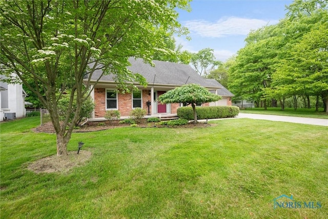 1956 Thornapple Dr, Toledo, OH 43614 - view of front of property featuring concrete driveway, a front lawn, and brick siding