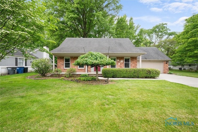 1956 Thornapple Dr, Toledo, OH 43614 - view of front facade featuring driveway, brick siding, an attached garage, and a front yard