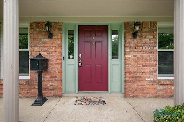 1956 Thornapple Dr, Toledo, OH 43614 - view of exterior entry with brick siding and a porch