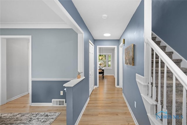 1956 Thornapple Dr, Toledo, OH 43614 - hallway featuring wood finished floors, baseboards, and stairs