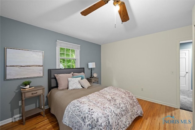 1956 Thornapple Dr, Toledo, OH 43614 - bedroom with wood finished floors, baseboards, and a ceiling fan
