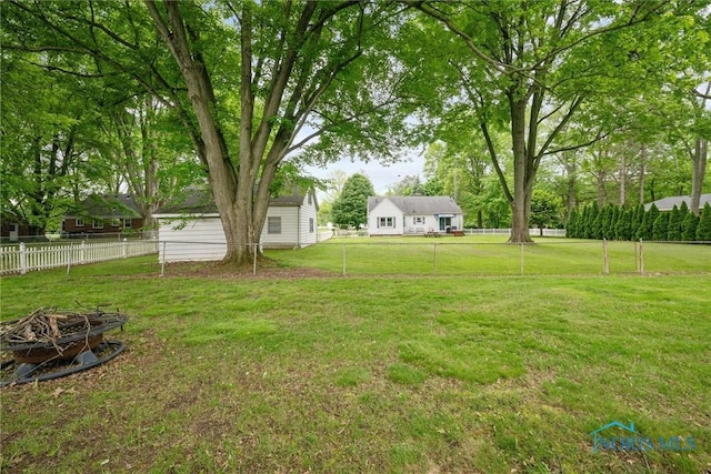1956 Thornapple Dr, Toledo, OH 43614 - view of yard featuring an outdoor fire pit