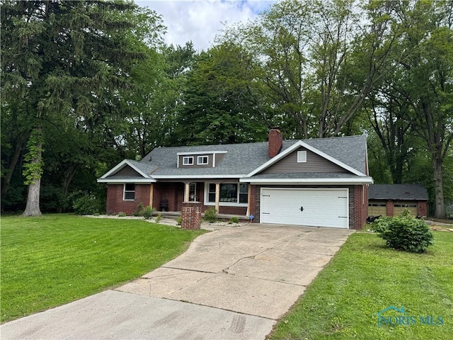 1226 Champe Rd, Toledo, OH 43615 - view of front of property with brick siding, a porch, a garage, and driveway