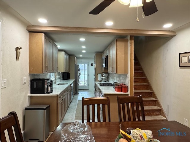 1226 Champe Rd, Toledo, OH 43615 - kitchen featuring tasteful backsplash, a sink, a ceiling fan, stainless steel appliances, and recessed lighting