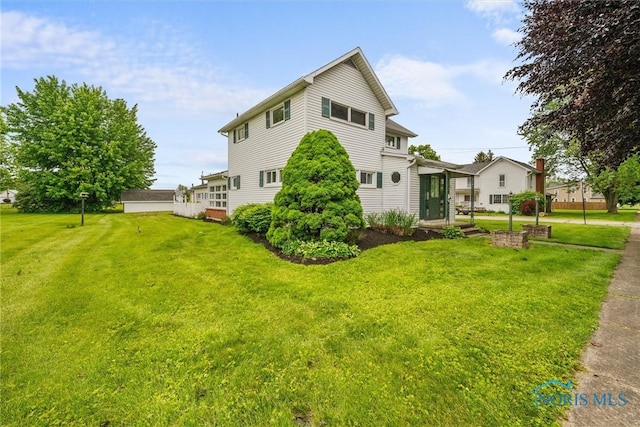 503 Church St, Helena, OH 43435 - view of side of property with a yard
