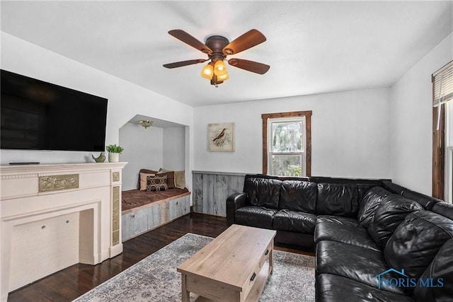 4279 Defiance Pike, Wayne, OH 43466 - living area featuring dark wood-style floors, a wainscoted wall, and ceiling fan